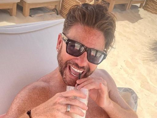 Gogglebox star Daniel Lustig soaks up the sun in tiny swimming trunks