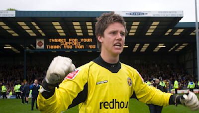 Former Shrewsbury Town penalty hero hangs up his gloves