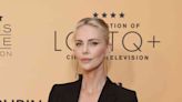 Charlize Theron Pairs a Plunging Blazer Dress with a Flirty Lace Bra