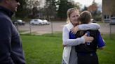 Teresa Mauer hugs her granddaughter Lauren Mauer after her softball game at Cretin-Derham Hall in St. Paul, Minnesota, on May 3, 2024.
