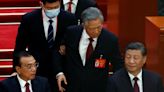 Ex-Chinese president unexpectedly led out of Communist Party congress