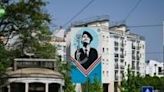 A flower placed in a gun -- as depicted in a giant mural in Lisbon -- has become a symbol of Portugal's 1974 'Carnation Revolution'