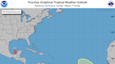 Tropical Storm Karl strengthens again. NHC watching disturbance for potential development