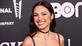 Olivia Rodrigo Performs at the Rock Hall of Fame Induction in a ’90s Cutout Dress and Garters