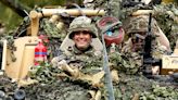 Camouflage Kate drives armoured vehicle with machine gun at Queen's Dragoon Guards