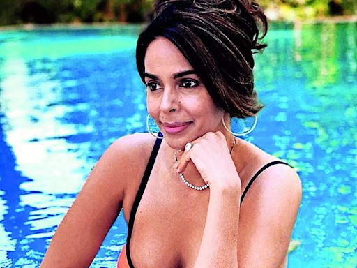 Mallika flaunts her bikini body