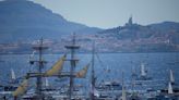 A ship carrying the Olympic torch arrives in Marseille amid fanfare and high security