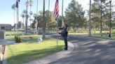 Volunteers place flags on veterans' graves in honor of Memorial Day