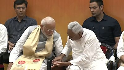 Nitish Kumar Grabs PM's Inked Finger At Nalanda Opening, Video Is Viral