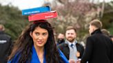 Woman hides a whole pizza in her fascinator at Cheltenham Festival Ladies Day