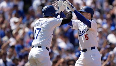 Shohei Ohtani reaches 3 times in home debut as the Dodgers rout the Cardinals 7-1