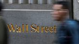 Wall St slips as higher yields offset upbeat corporate earnings