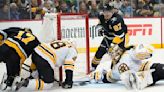 Lindholm’s OT goal lifts Bruins over Penguins