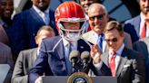 Chiefs White House visit: Joe Biden wears helmet, welcomes Travis Kelce to podium | Sporting News