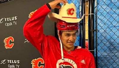 Flames fan gifts custom cowboy hat to top prospect Parekh | Offside