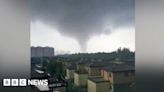 Watch: Debris flies through air as tornado hits China city