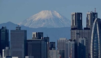 Holes found in black screen installed to block tourist snapshots of Mount Fuji