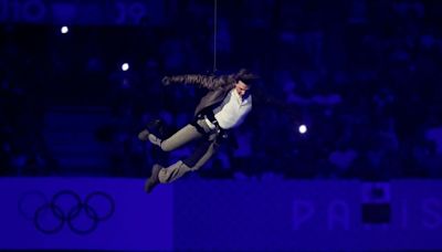 Paris Olympics closes with dystopian ceremony - as Tom Cruise abseils into stadium and Billie Eilish performs new hit