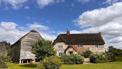 Inside multi-million 17th century farmhouse with river in garden