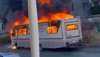 Horrifying moment family's RV bursts into flames