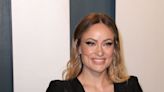 Olivia Wilde debuts newly cut 'French girl' bangs with a knotted doughnut updo