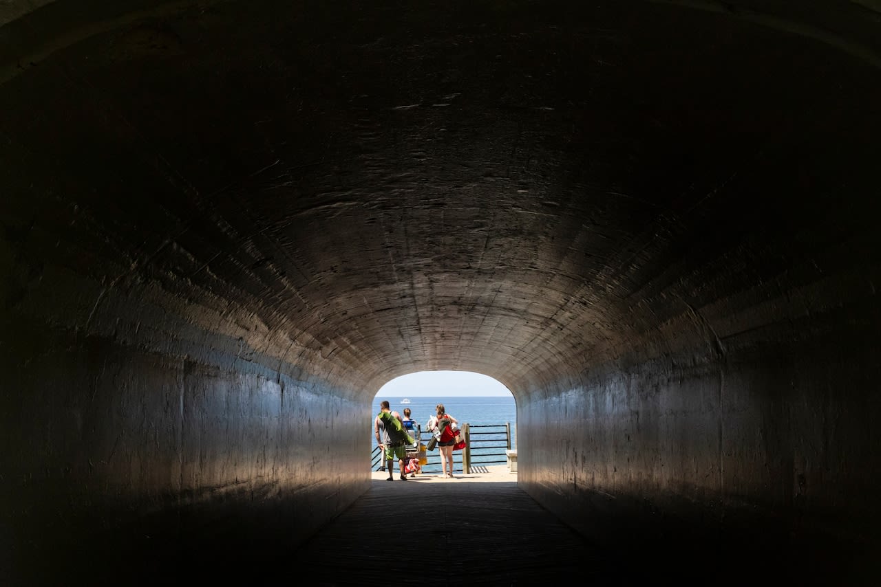 Tunnel through a sand dune to find expansive Lake Michigan beachfront