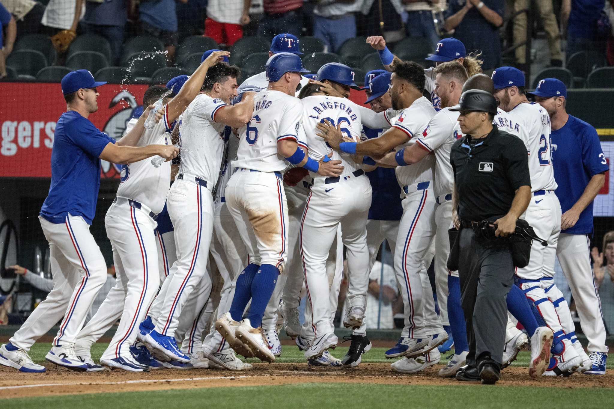 Texas Rangers keep walking it off this season with Langford's grand slam their latest game-ender