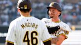 Padres beat Brewers, reach midway point with winning record