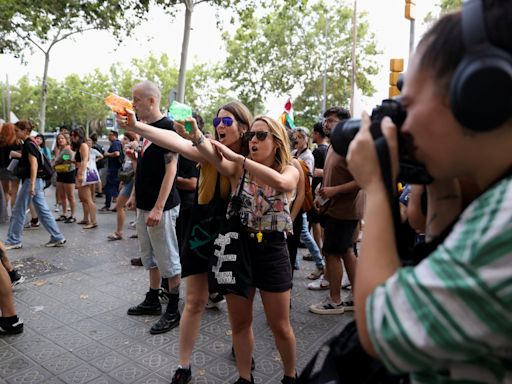 Angry Catalans fire water guns at Barcelona visitors in protest against mass tourism