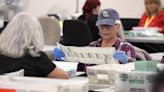 Fact check: Black duffle bags at Maricopa voting center part of counting process, not fraud