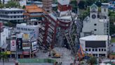 Crews clean up near a collapsed building following the earthquake on April 5, 2024, in Hualien, Taiwan.
