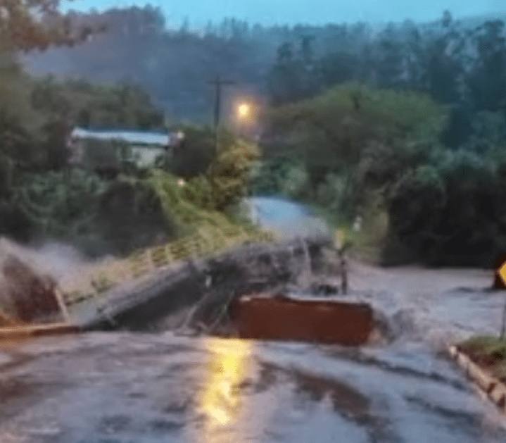 Bridge washes away on video as mayor warns of floods