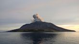 Airport near volcano reopens as Indonesia lowers eruption alert level