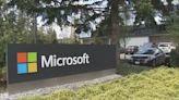 Microsoft profits down 14% as Windows hit by weak PC sales