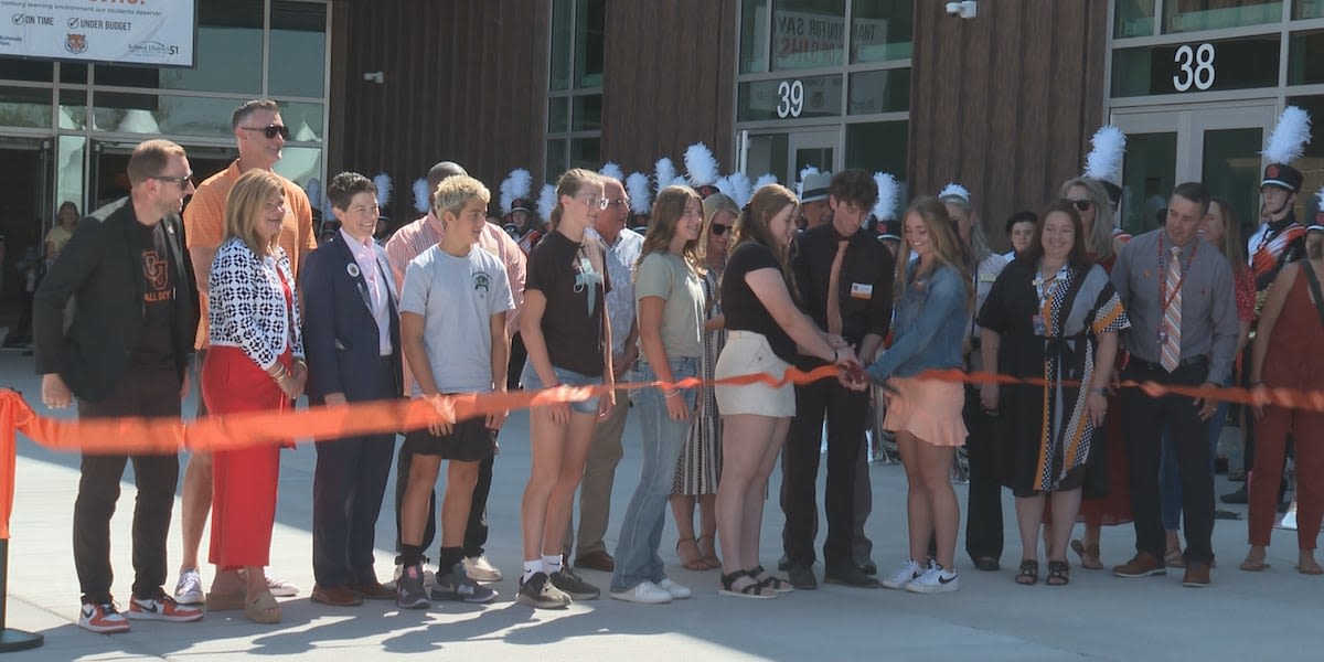Cutting the ribbon to the new Grand Junction High School