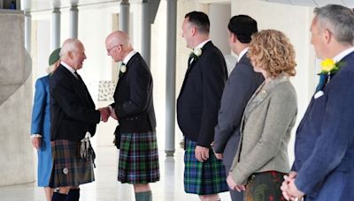 King Charles hails 'uniquely special' Scotland as it marks Holyrood milestone - before being hugged by woman