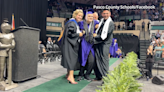 WATCH: Pasco student leaves wheelchair, walks across graduation stage