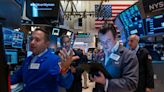 Dow soars to fresh record while gold prices hit all-time high