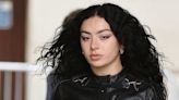 Charli XCX Revs Up Her Moto Jacket With Some Trippy Black Wide-Legged Jeans