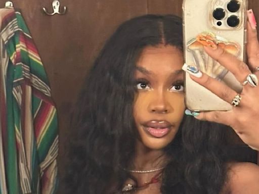 SZA Flexes Her Gymnastic Skills As She Performs Handstand With Simone Biles