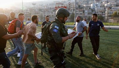 Israel hits Hezbollah targets in Lebanon after deadly football pitch attack