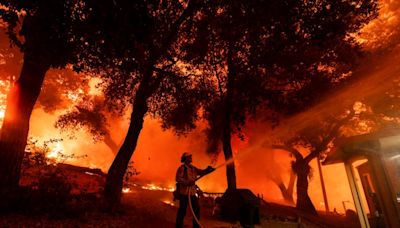 Airport Fire in Riverside, Orange counties slows but still threatens homes