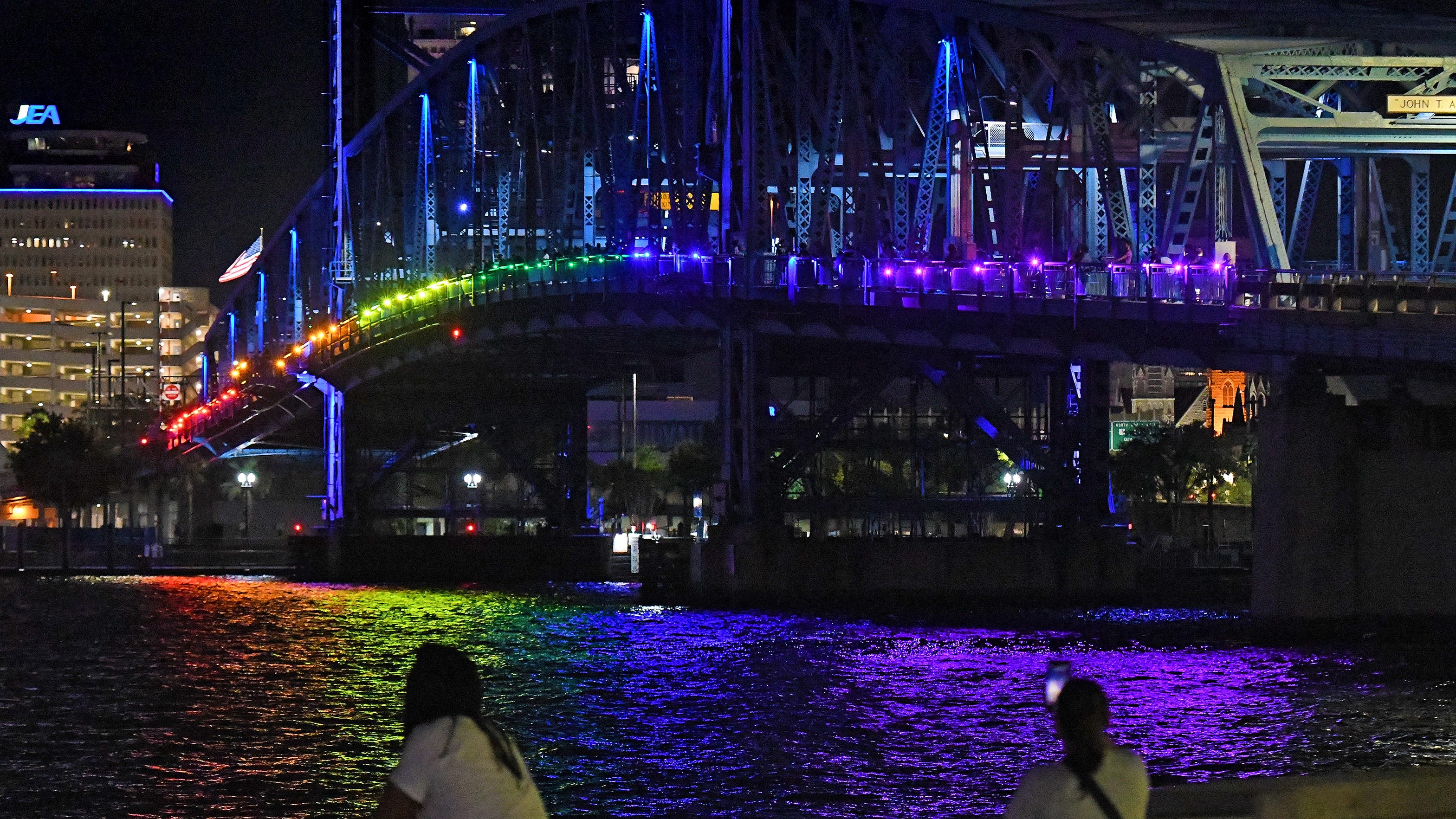 Rainbow colors lit the Main Street Bridge as a counter to Governor's lighting mandate
