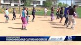 Indigenous hoop dancer teaching powwow workouts in Santa Fe