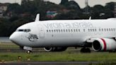 Passenger accused of running naked through Virgin Australia airliner mid-flight, knocking down crew member