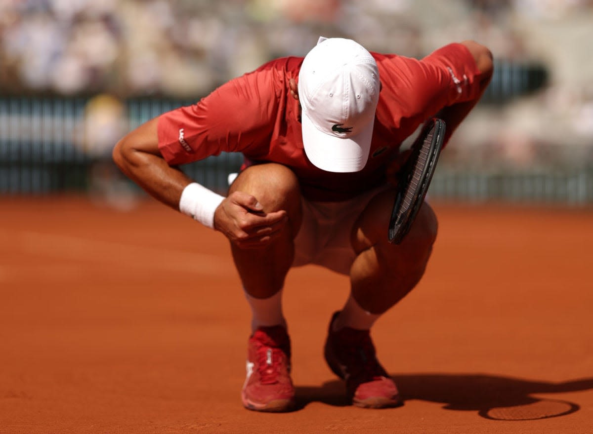 French Open LIVE: Novak Djokovic battles injury and trails Francisco Cerundolo - latest score