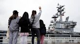 U.S. Navy flagship carrier USS Ronald Reagan leaves its Japan home port after nearly 9 years