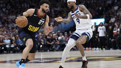 Timberwolves' Nickeil Alexander-Walker was smiling in the middle of shutting down Jamal Murray