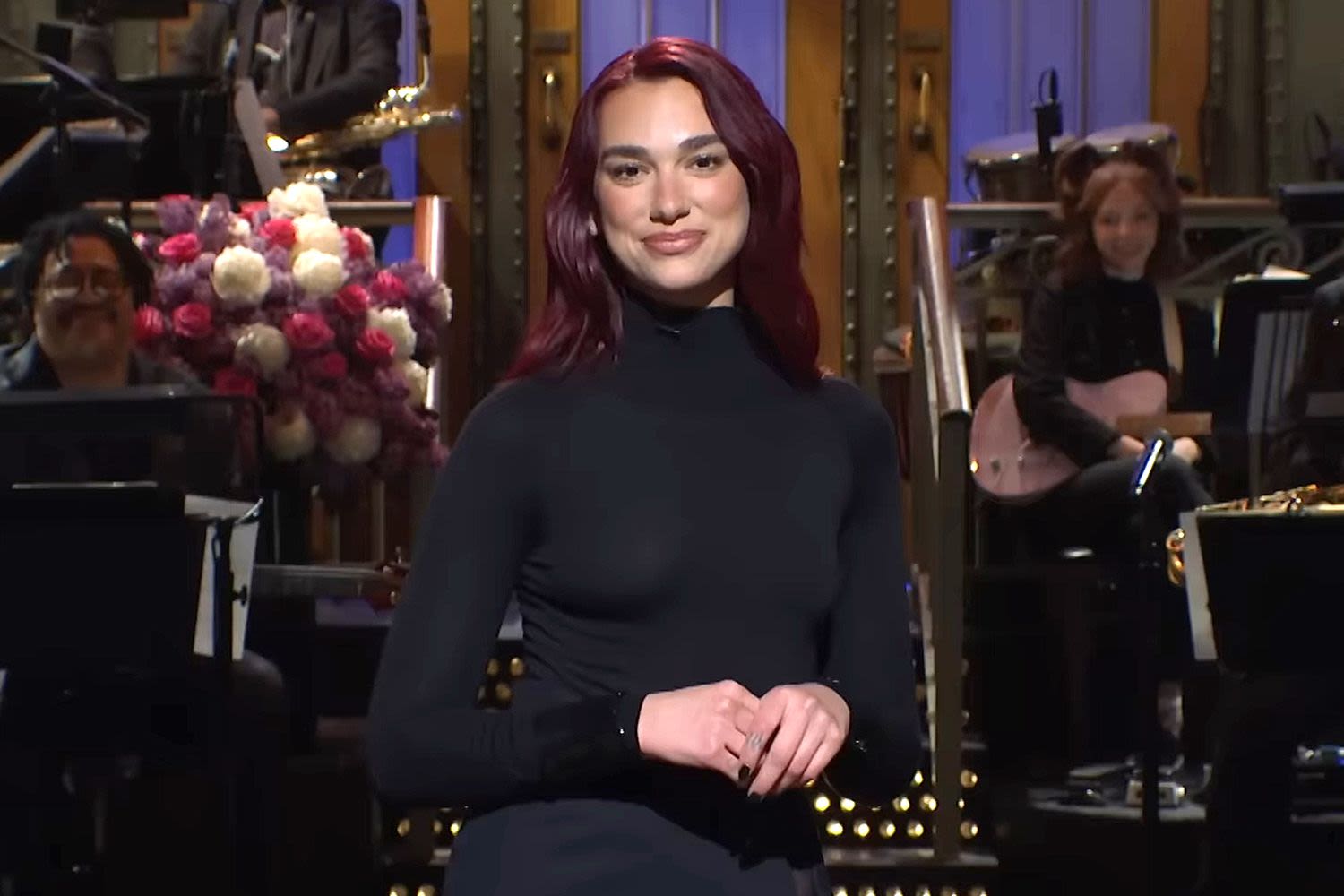 Dua Lipa's 'SNL' Monologue Nods to Kristi Noem Shooting Her Puppy, as Jerry Seinfeld, Troye Sivan Cameo on Show