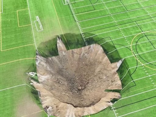 Videos capture giant sinkhole opening up in middle of Illinois soccer field